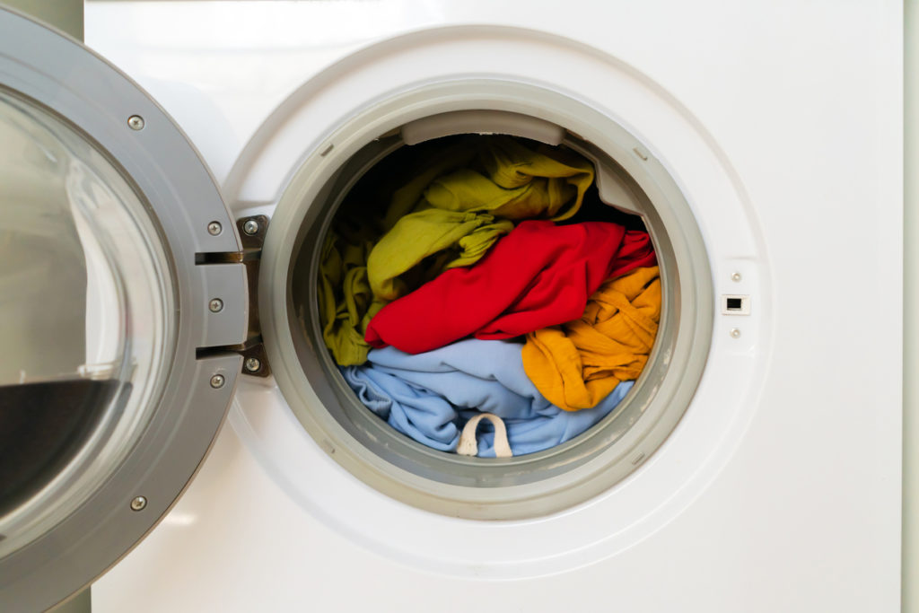 Bright clothes inside washing machine.